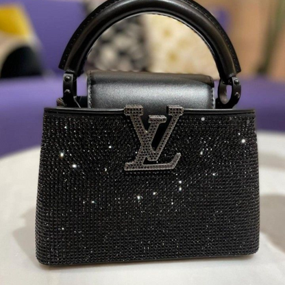 LOUIS VUITTON CAPUCINES MINI-CARTERA