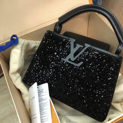 LOUIS VUITTON CAPUCINES MINI-CARTERA